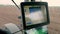 CHERKASY, UKRAINE, APRIL 28, 2020: view from tractor cab. close-up of monitor for tracking quality of sowing corn with