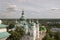 Chernigov, Ukraine. August 15, 2017. Christian orthodox white church with green domes and gold crosses. View from high. Calm sky