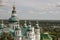 Chernigov, Ukraine. August 15, 2017. Christian orthodox white church with green domes and gold crosses. View from high. Calm sky