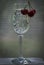 Cherries on a crystal glass with a high stem. Summer still life