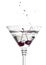 Cherries splashing into martini glass