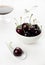 Cherries white spoon and bowl, sherry glass