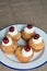 Cherry and Almond buns on a plate with copy space