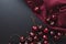 Cherry background. Cherries on a black top view. Elegant rich cherry background. Burgundy background with summer harvest of cherry