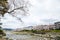 Cherry blossoms on the Bank along Takano River, and mount Hieizan, Kyoto, Japan