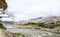 Cherry blossoms on the Bank along Takano River, and mount Hieizan, Kyoto, Japan