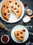 Cherry cake on a black background with the ingredients, baking f