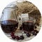 Cherry and cherry juice or wine on a wooden table, a decanter and a glass with juice, a basket with cherries