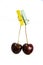 Cherry hanging on a clothespin on a rope