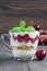 Cherry, muesli and yogurt dessert in glass cup, cherry verrine