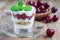 Cherry, muesli and yogurt dessert in glass, verrine, horizontal