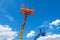 Cherry pickers on blue sky background