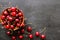Cherry in a plate on a black background with space for text