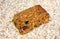 Cherry and raisin flapjack on an oat background