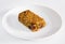 Cherry and raisin flapjack on a white plate