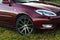 Cherry red 4 door family d-class sedan Toyota Camry