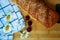 Cherry strudel on a wooden board with cherry berries and field daisies and a glass of milk