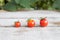 Cherry tomato, small tomatoes on wooden background