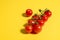 Cherry tomato on yellow. Concept. Vegetable