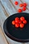 Cherry tomatoes in a black plate