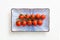 Cherry tomatoes on a ceramic rectangle plate