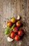 Cherry tomatoes, garlic and fresh basil on vintage wood table