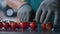 Cherry tomatoes packing process unknown worker cutting green parts closeup