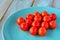 Cherry tomatoes on a turquoise plate