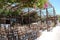 Chersonissos, Cyprus, Greece - 31.07.2013: a lot of chairs in the garden under the summer hot sky and a canopy of flowers