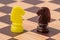 Chess board with brown and yellow horse