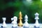 Chess board game, king surrounding by knight, rook, bishop and queen situation, business competitive concept, copy space