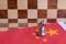 Chess board game pieces on USA and China flag background, trade war tension situation concept