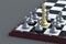 Chess figure king golden color and many silver color pawns