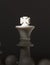 Chess figure king with light on crown. White chess king. Chessmate victory concept photo