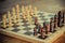 Chess game set with wooden chess pieces.