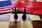 Chess game. Two kings face to face on Chinese and American national flags. Trade war and conflict between two big countries. USA