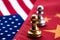 Chess game, two knights face to face on China and US national flags. Trade war concept. Conflict between two big countries, USA