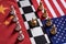 Chess game. Two team stand confront each other on China and USA national flags with golden crown in the middle. Trade war concept