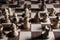 Chess game. White and black pieces are fighting for victory. The Central figure is in focus.