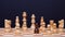 Chess, a lot of chess pieces on the Board. The white pieces surrounded the black pawn.