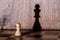 Chess pawn with queen shadow on chess-board. Conceptual picture - dreaming and confidence in one`s strength
