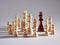 Chess piece king is surrounded by the rival pieces. Winning strategy in business