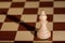 Chess piece - a white bishop on a chessboard.