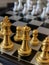 Chess pieces, focus on golden Queen
