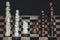 Chess pieces knights facing each other for a standoff on chessboard with blurred background. Chess knights confronting each other