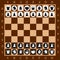 Chess. Table game. Set of black and white figures. Brown checkered board.