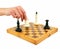 Chessboard and female hand gives check