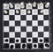 Chessboard with figures, black and white cells, background, texture.