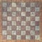 Chessboard made of stone tiles as background