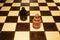 A chessboard with two opposing pawns